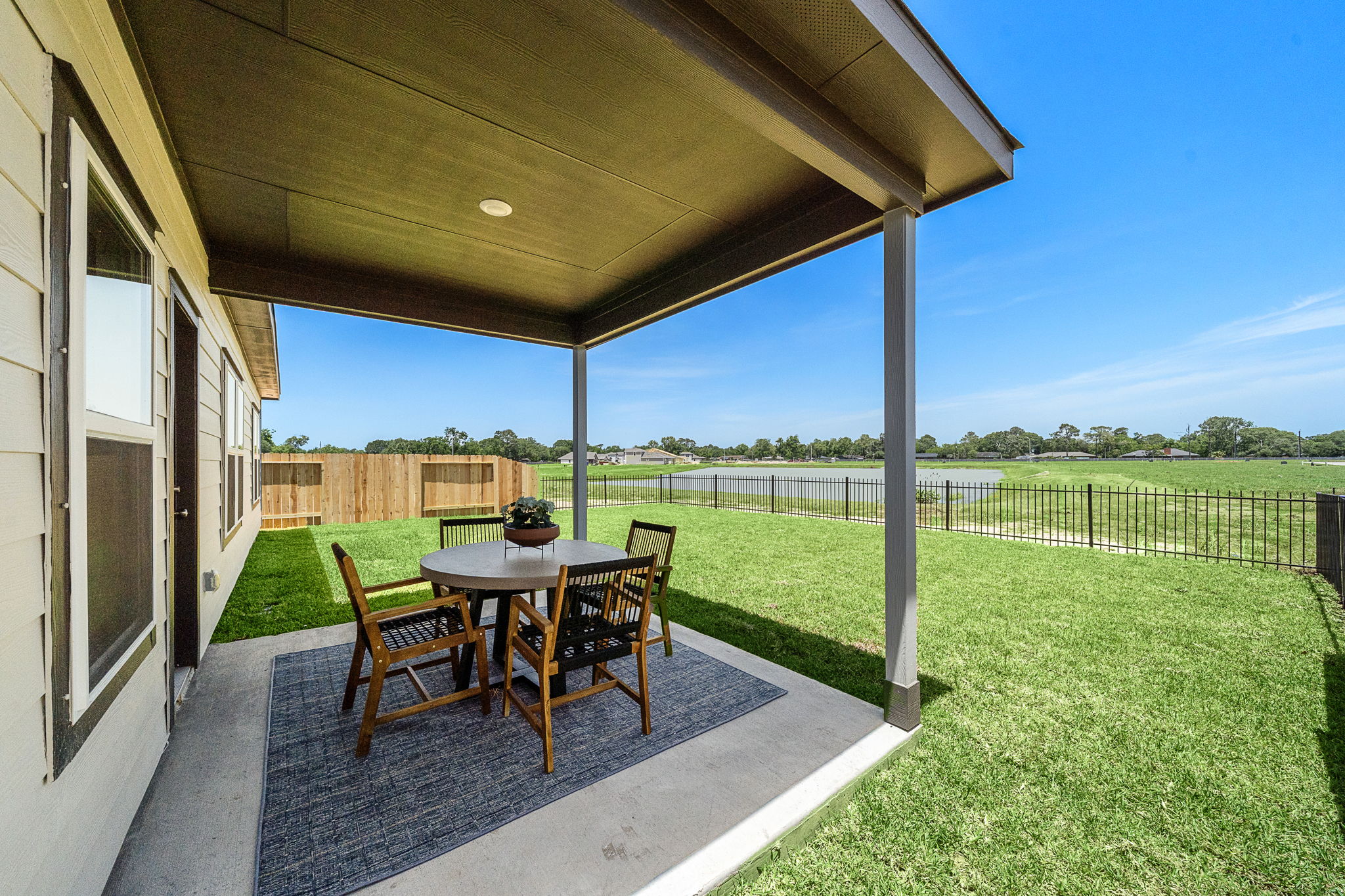 A table and chairs on a deck.
