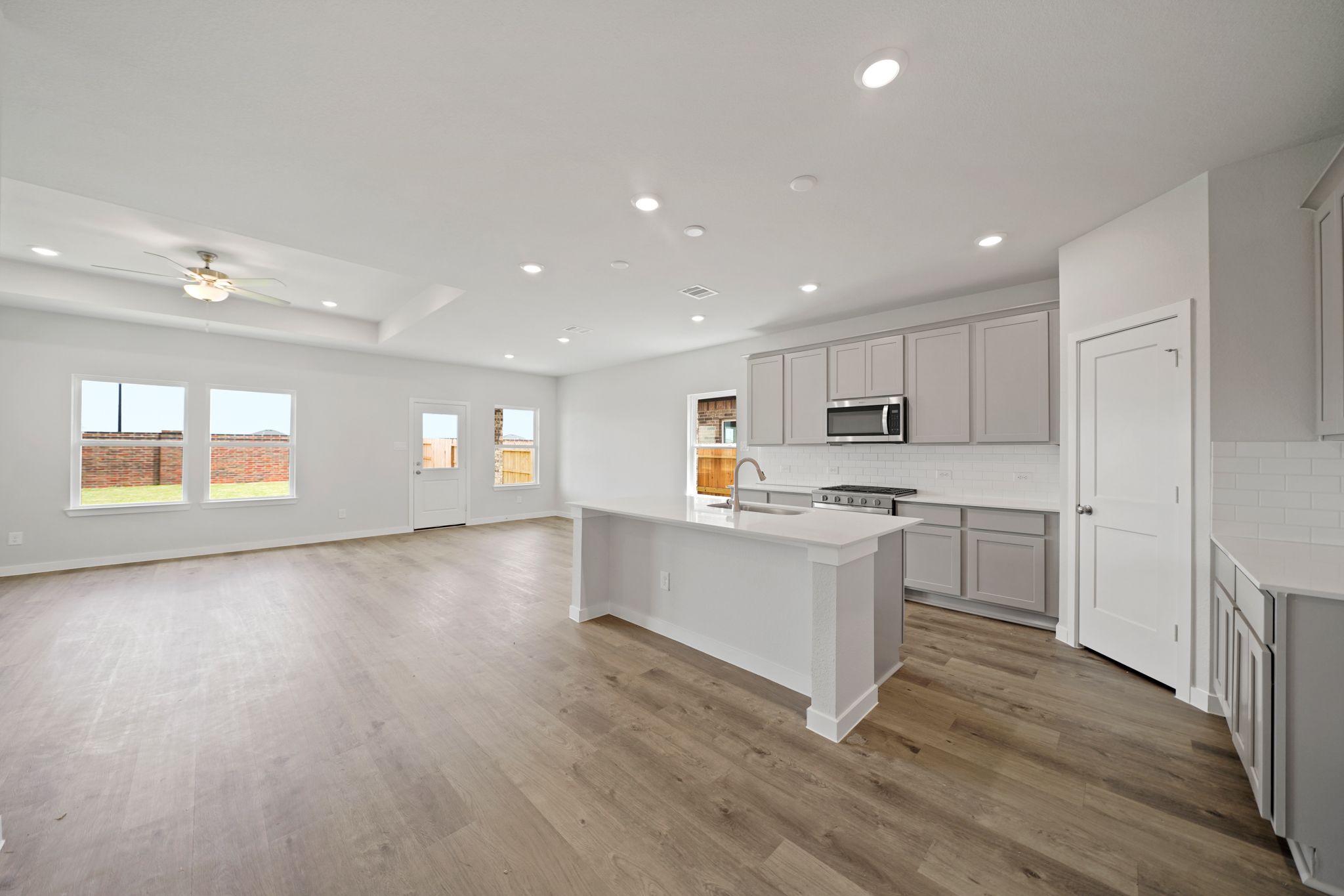 A large kitchen with white cabinets.