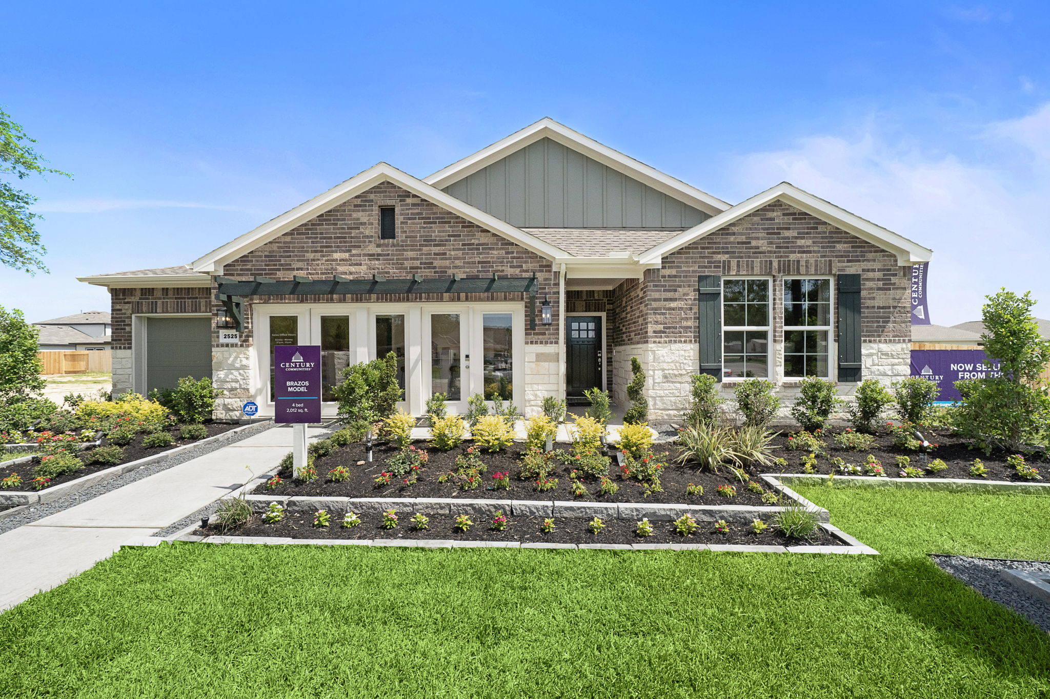 A house with a fountain in the front.