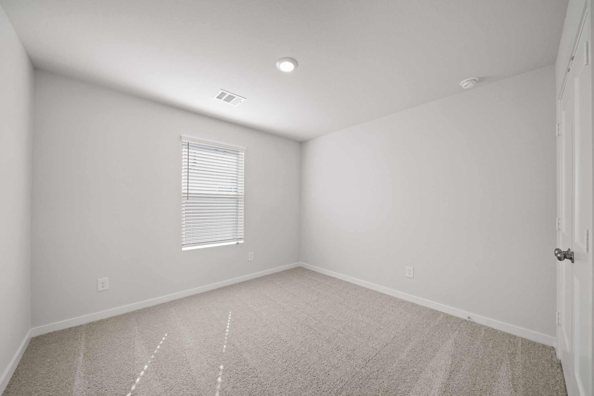 A room with a door and a window.