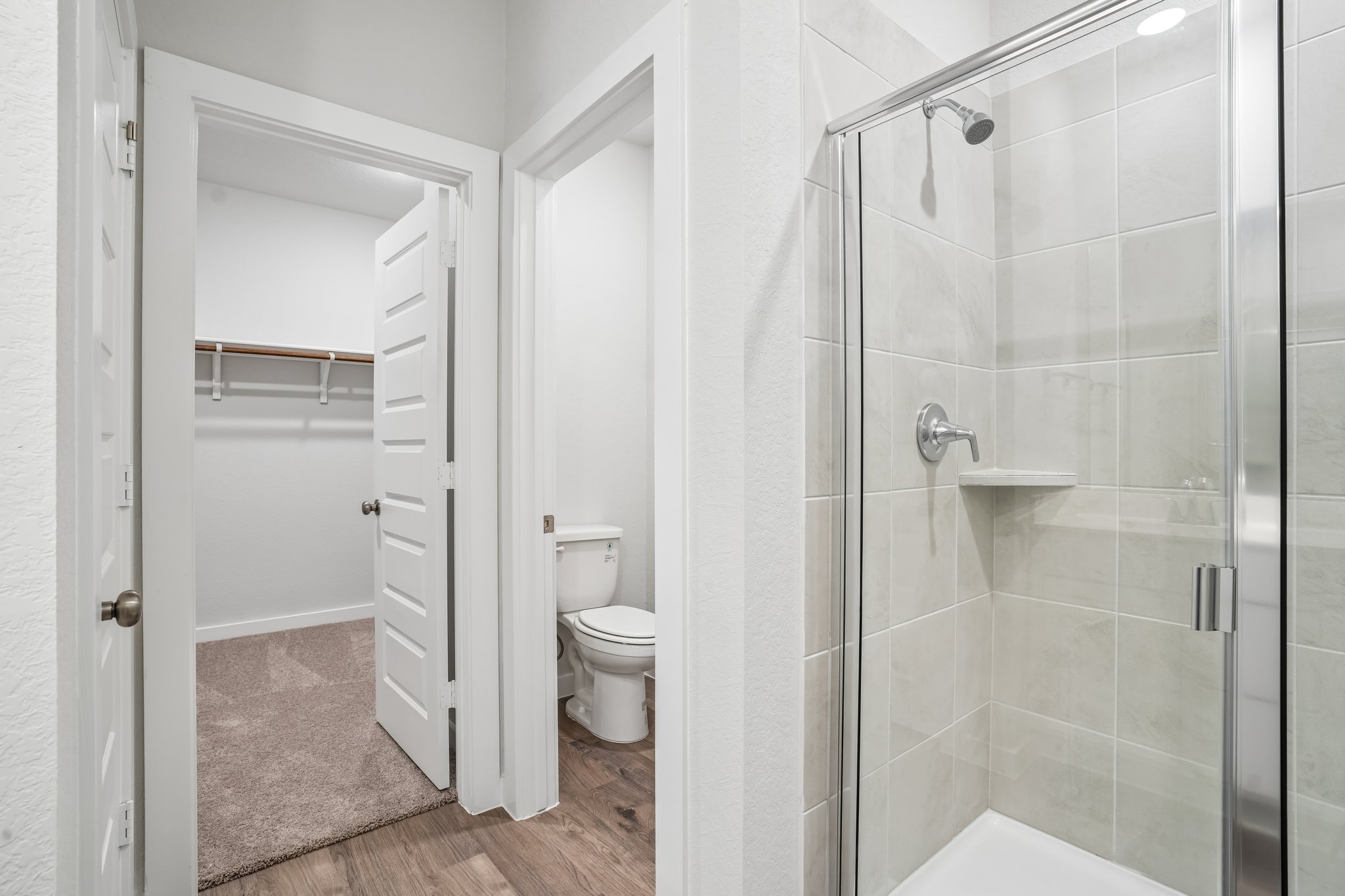 A bathroom with a glass shower.