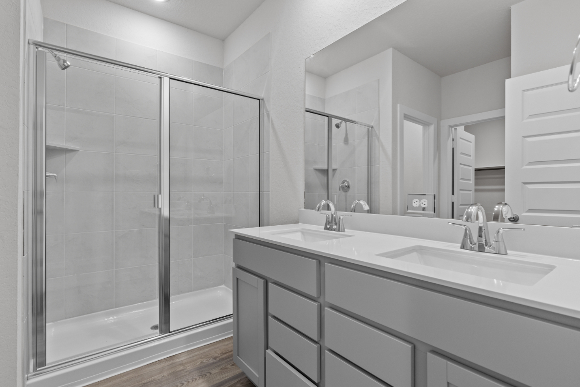 A bathroom with a glass shower.