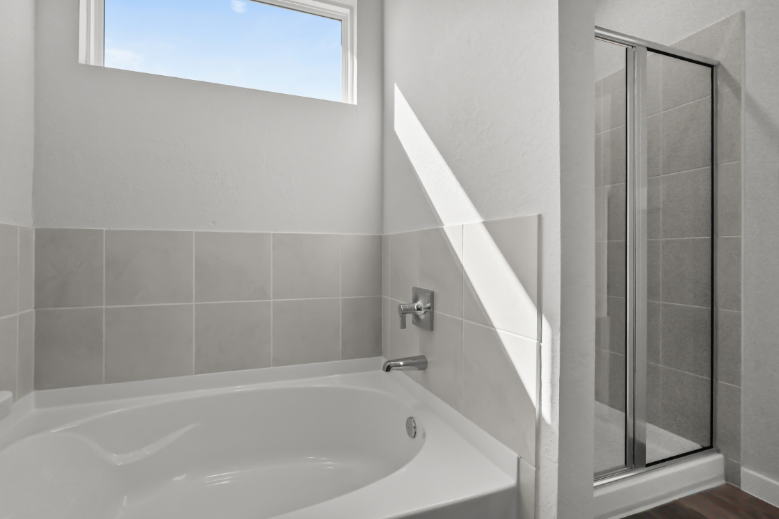 A bathtub in a bathroom.