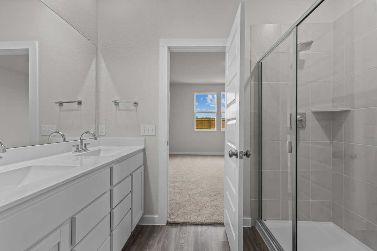A bathroom with a glass shower.