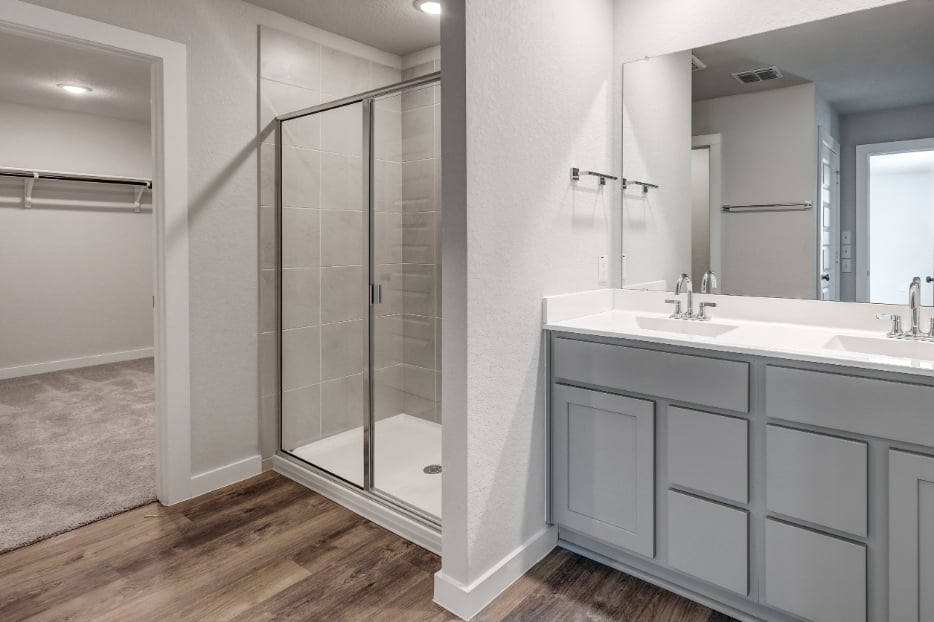 A bathroom with a glass shower.