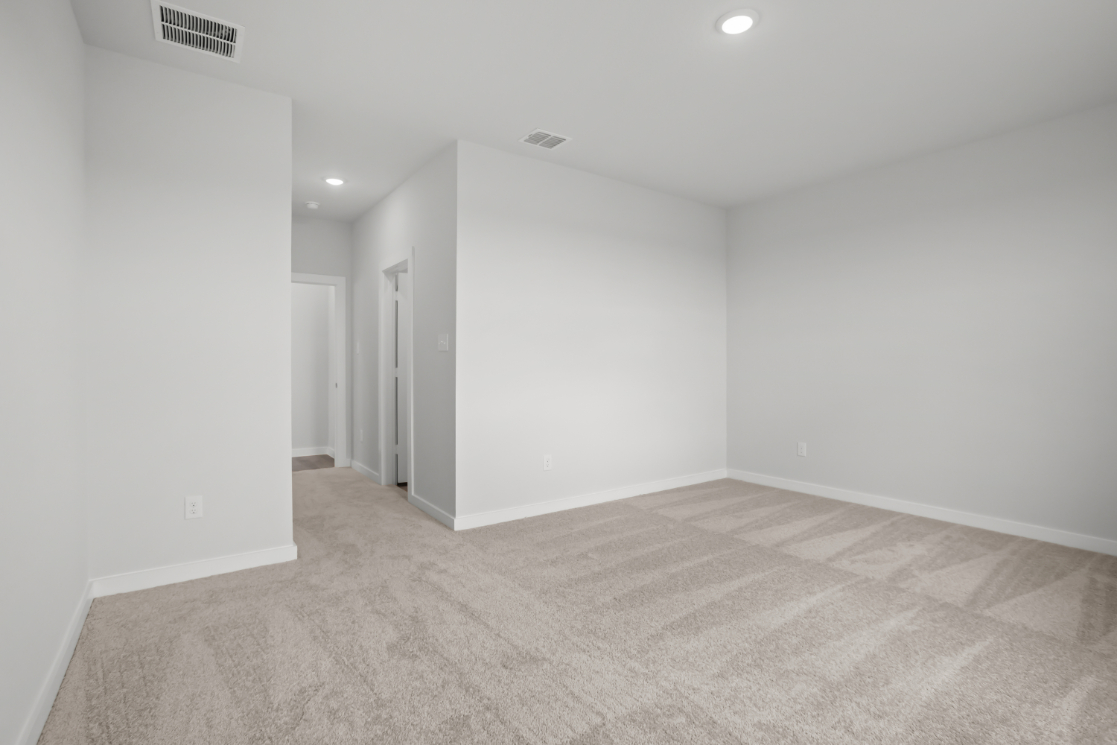 A hallway with white walls.