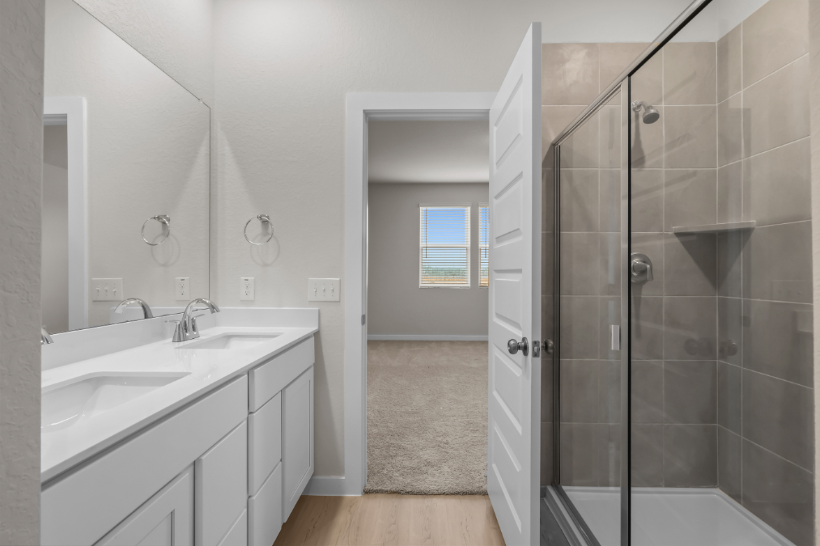 A bathroom with a glass shower.