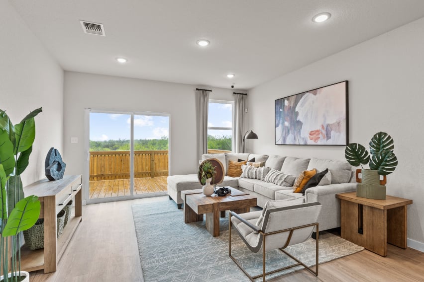 A living room with a large glass door.