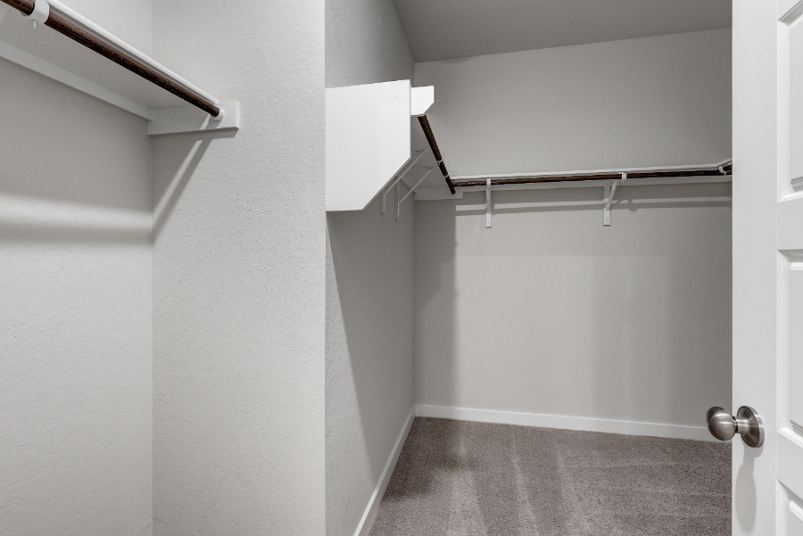 A hallway with white walls.