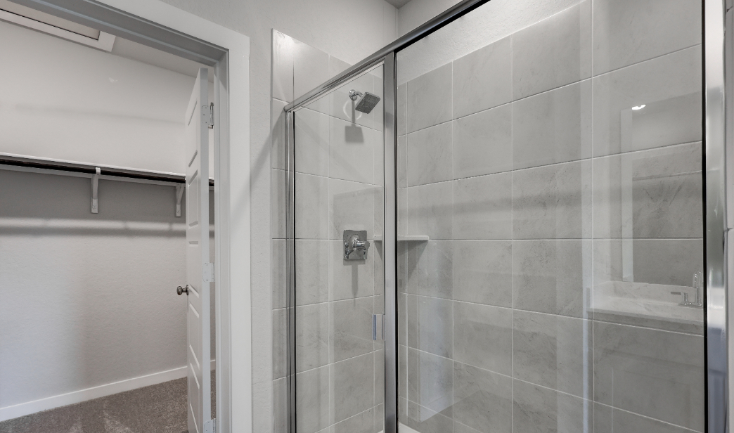A shower with glass doors.