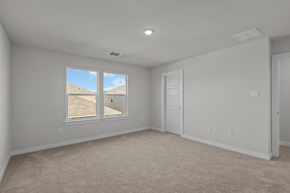 A room with a window and a door.