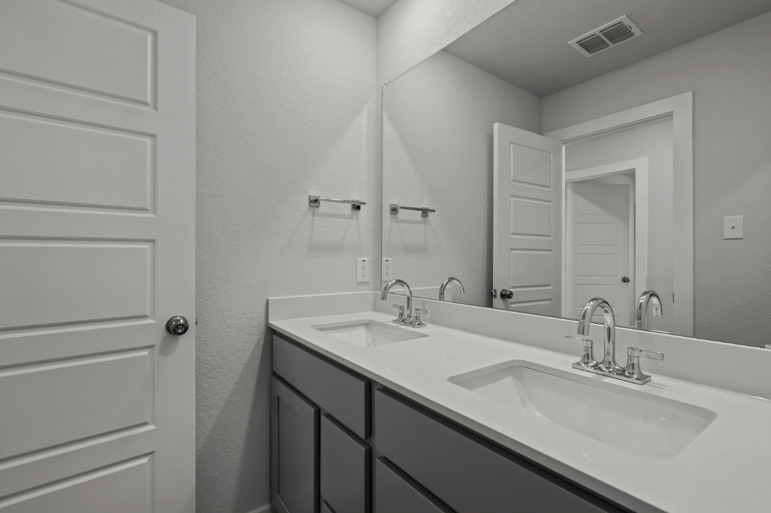 A bathroom with two sinks.