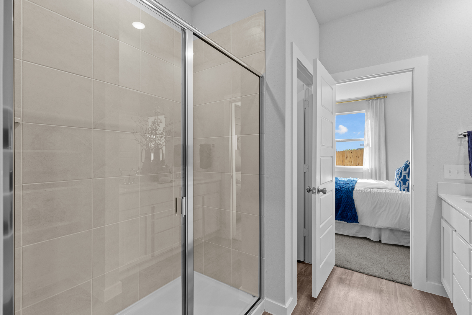 A bathroom with a glass shower.