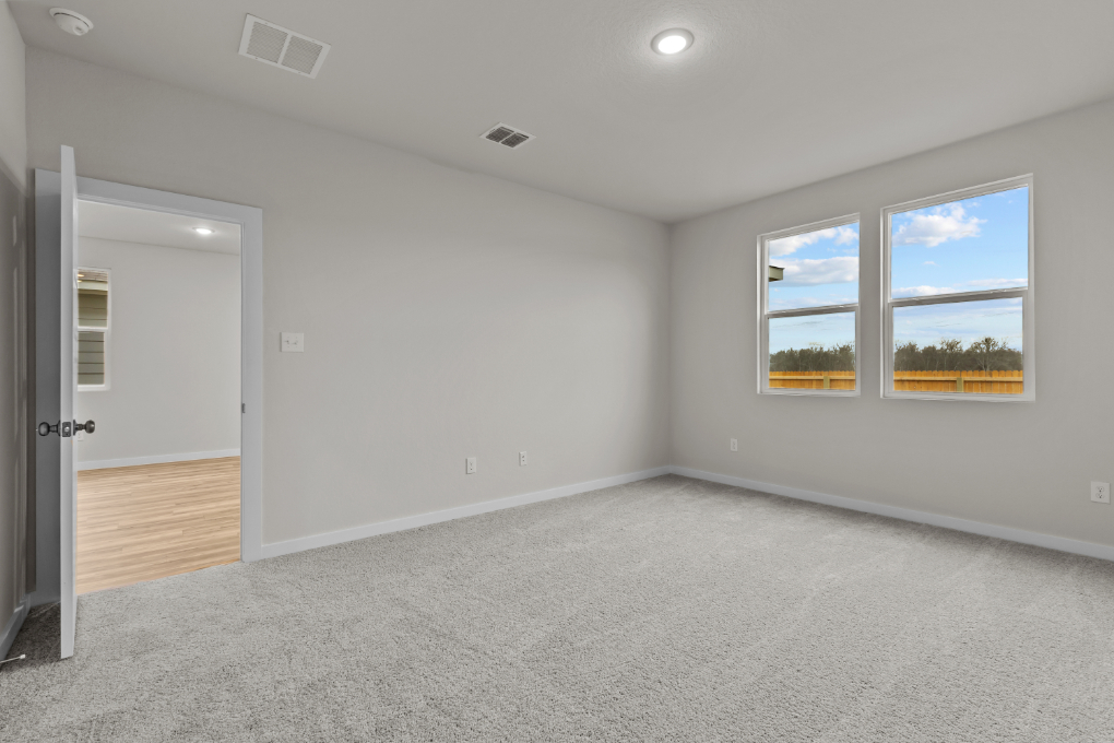 A room with a window and a door.