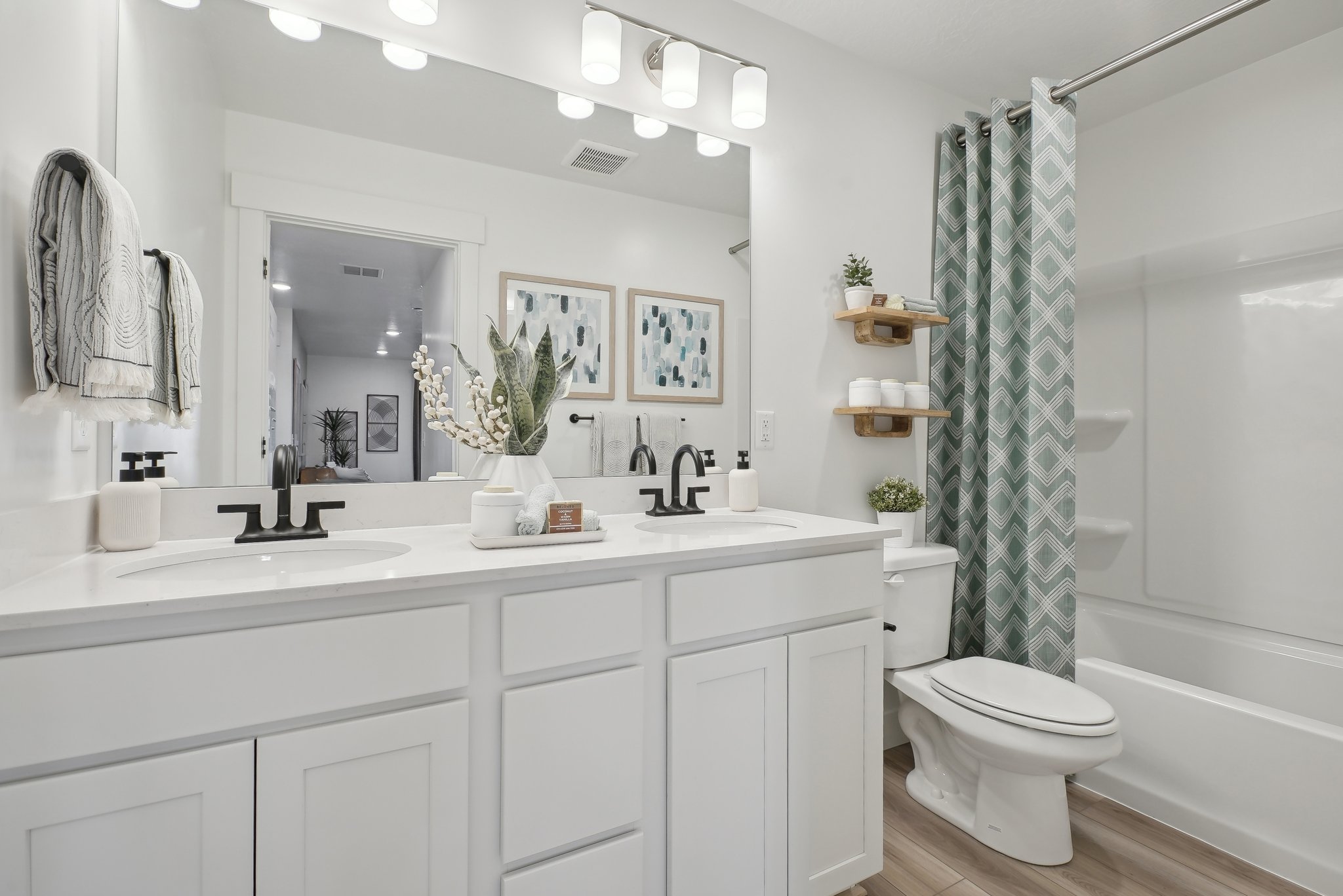 A bathroom with a tub toilet and sink.