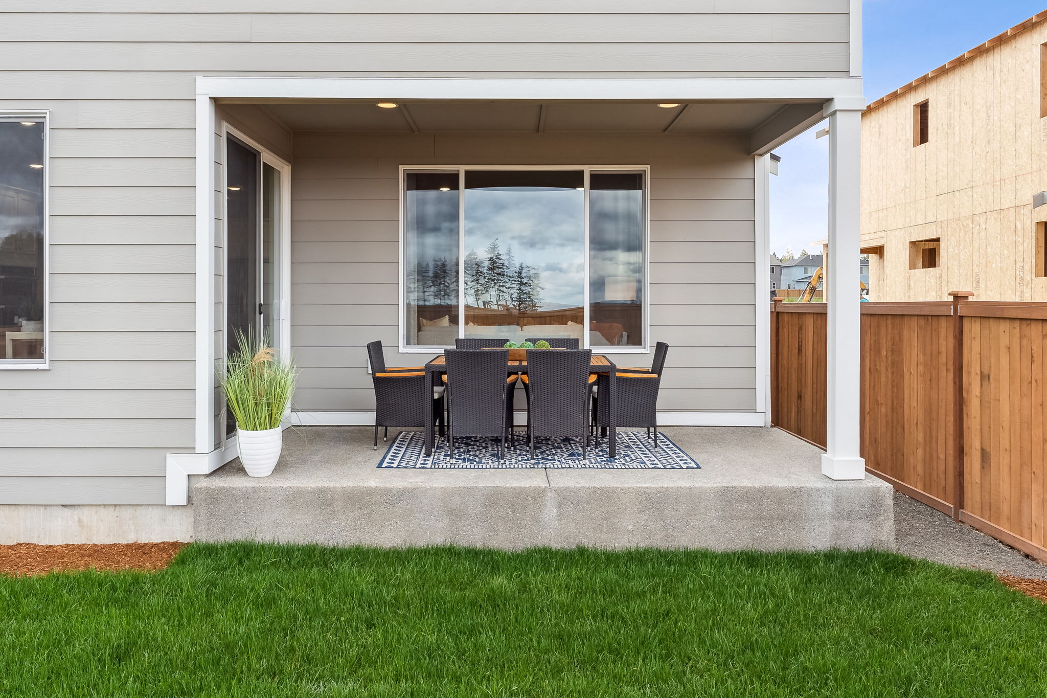 A patio with a table and chairs.
