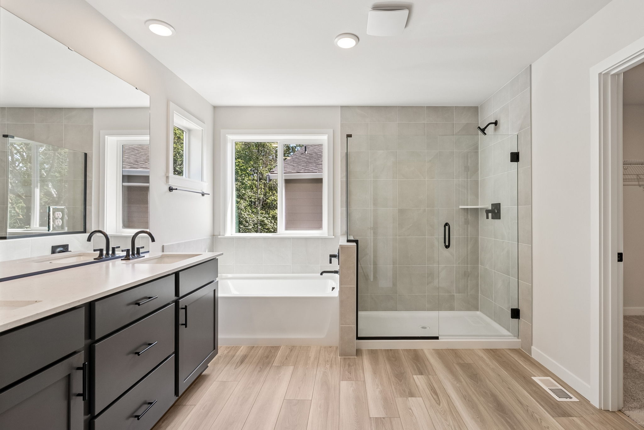 A bathroom with a tub and sink.
