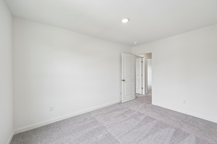 A hallway with white walls.