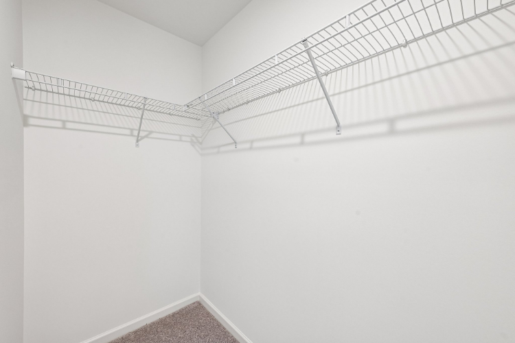 A white wall with a vent.