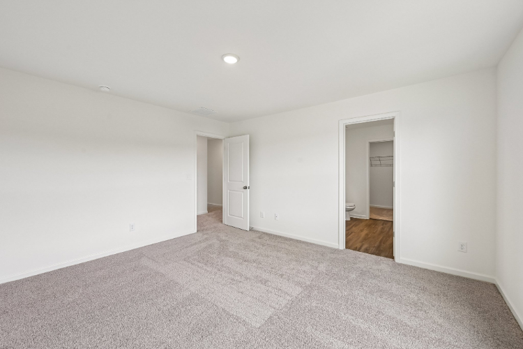 A hallway with white walls.