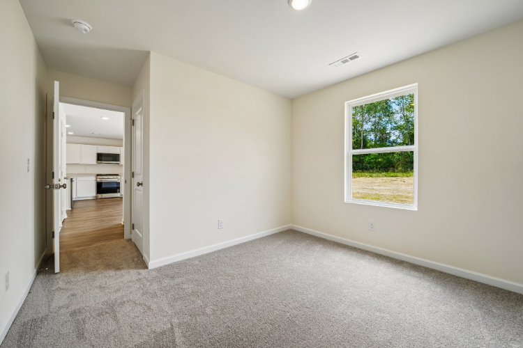 A room with a window and a door.