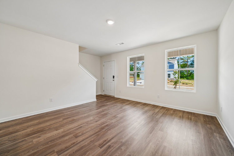 A room with a wood floor and a wood floor.