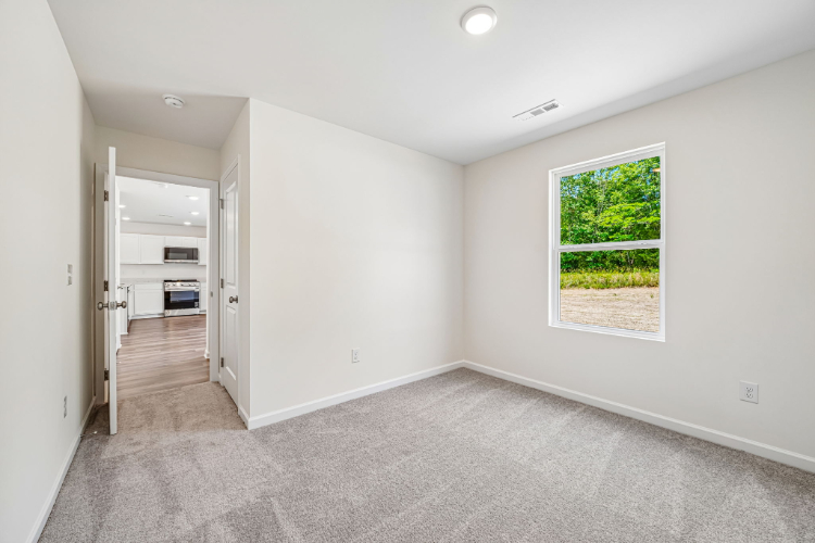 A room with a window and a door.