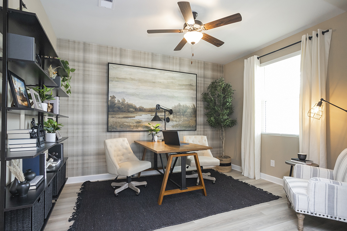 A room with a table and chairs.