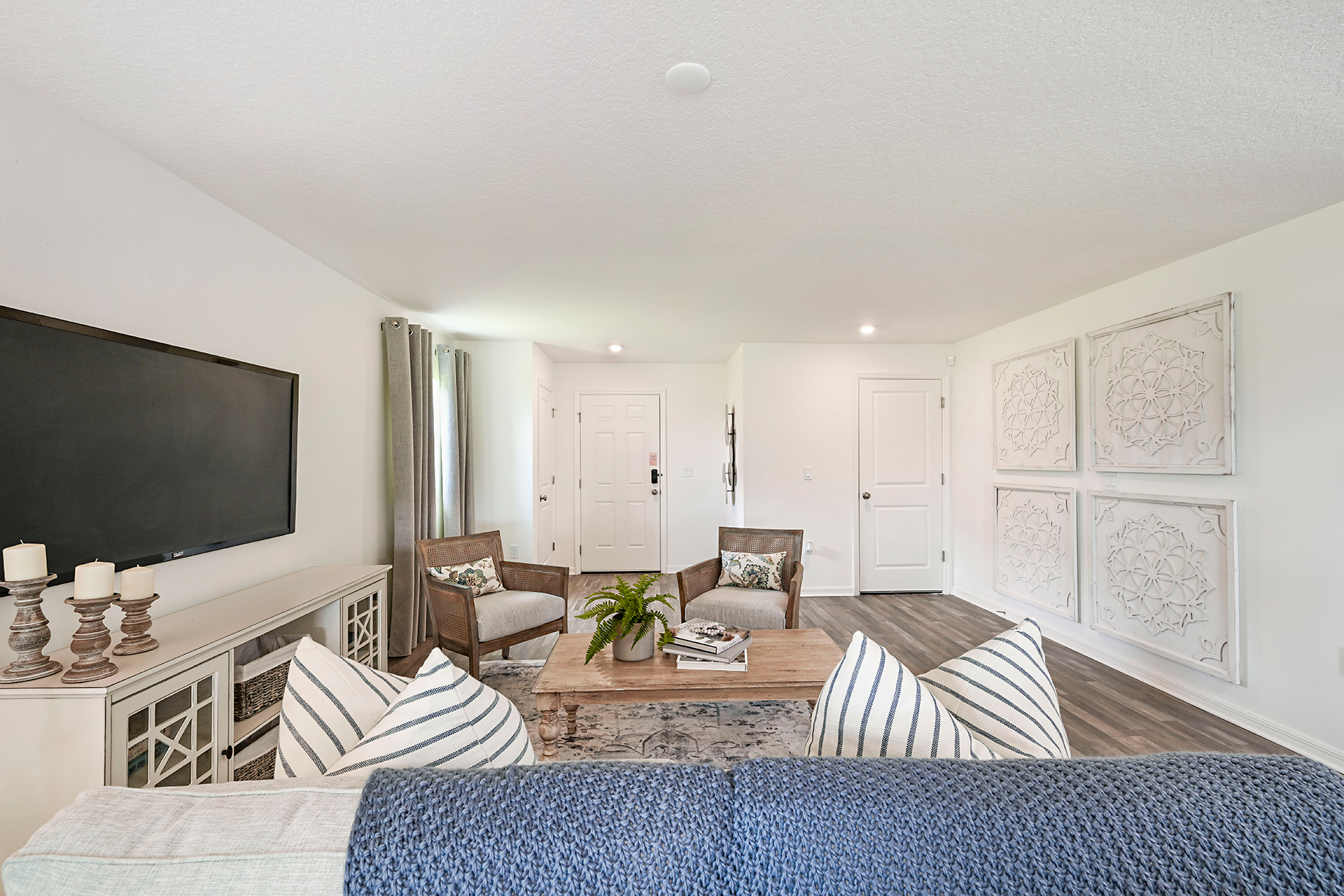 A living room with a tv and couches.