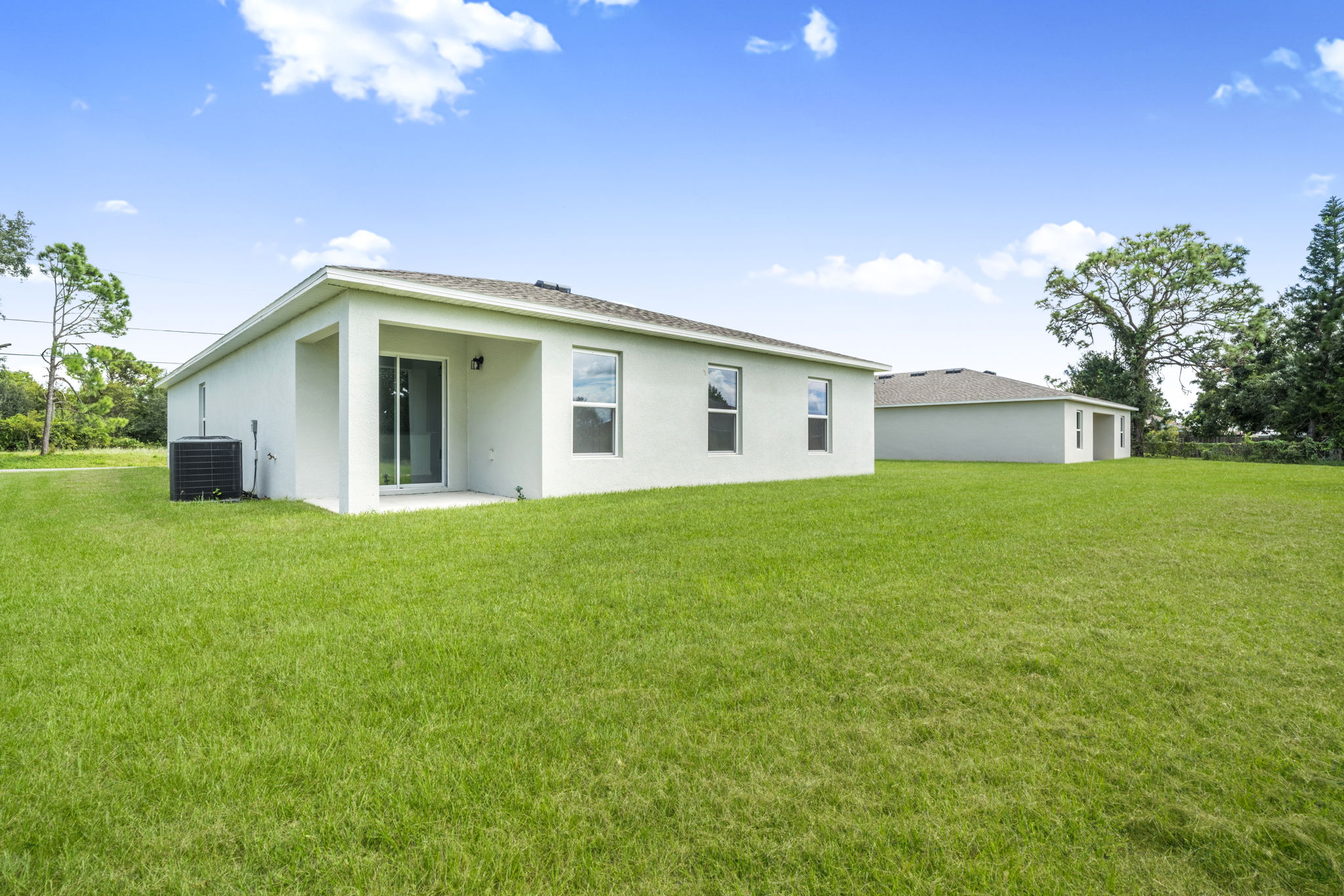 A house with a grass yard.