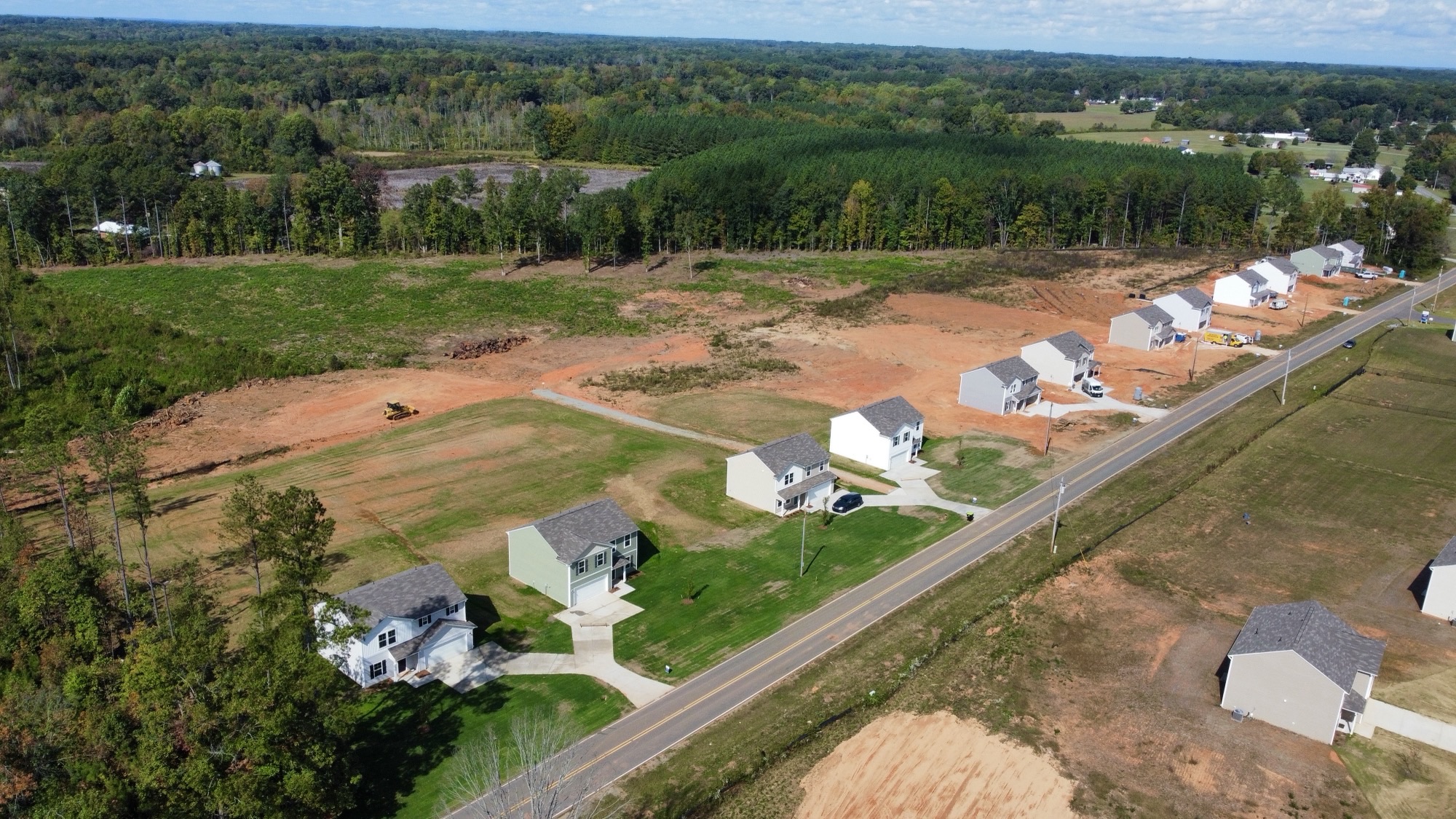 A group of buildings in a field.